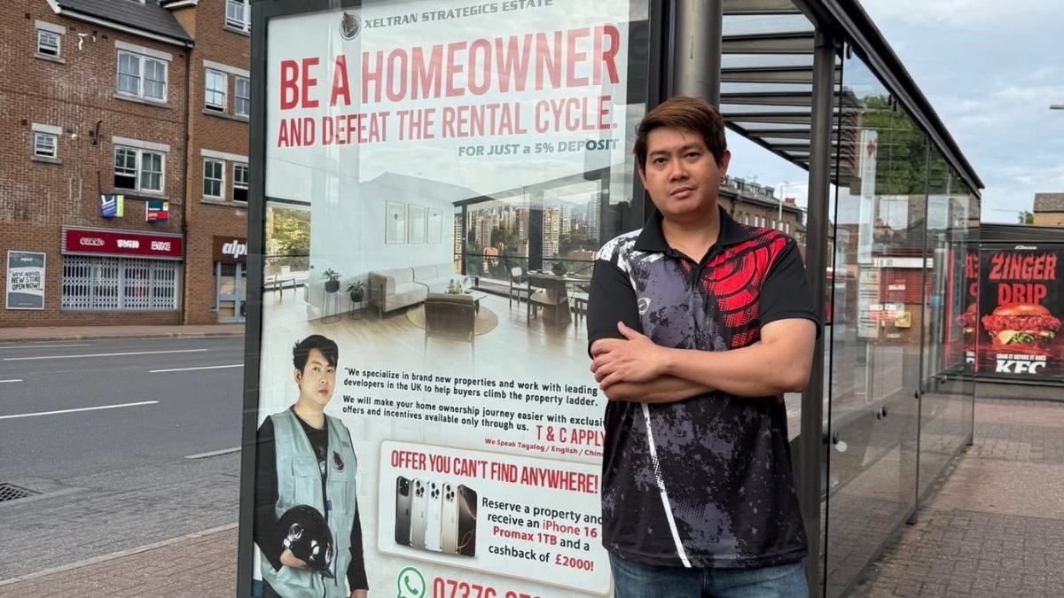Jan Filiu of Xeltran Strategics Estate beside a Xeltran bus stop advert, as featured in The Global Filipino Magazine